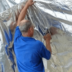 staple conservatory roof insulation into position