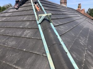 hip tiles being bedded on in new roof installation morecambe